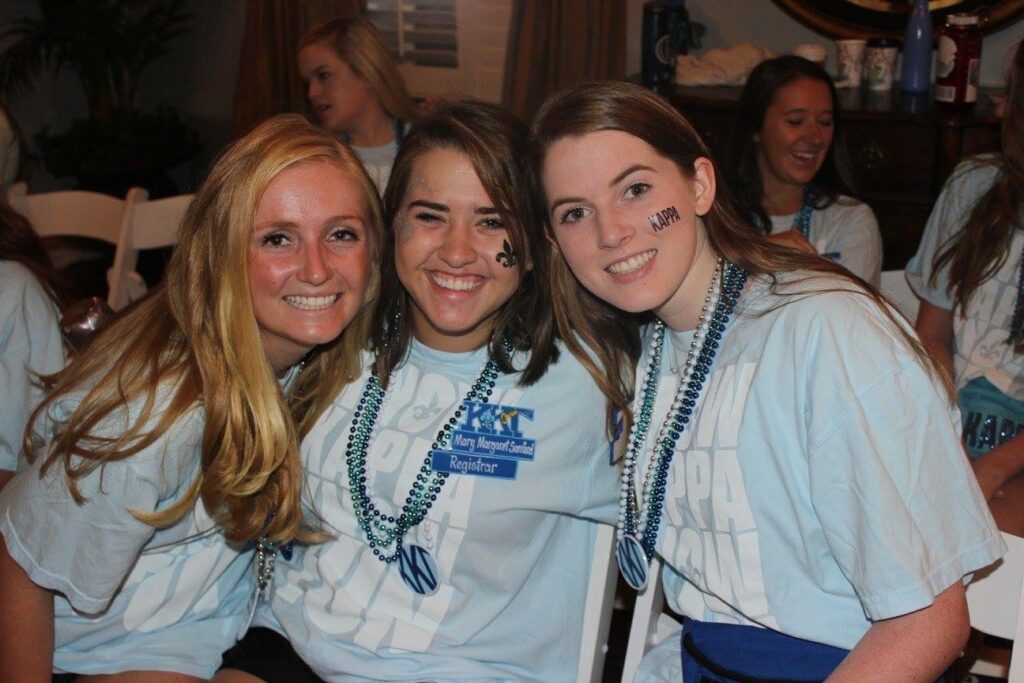 A picture of two of my friends and me at TCU during recruitment workshop the year I was Registrar.